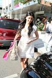 Kim Kardashian shows big cleavage in white dress shopping in Hollywood